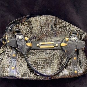 Never used Jimmy Choo black and gold purse